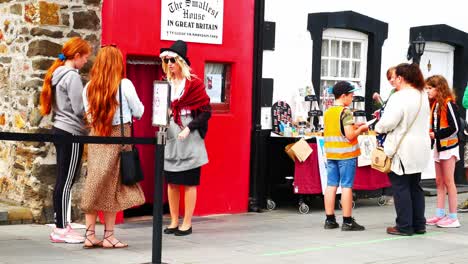 Famous-tiny-red-terraced-house-Welsh-tourist-guide-attraction-Wales-landmark