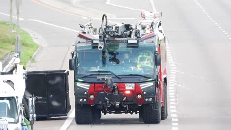 A-front-view-of-a-rare-airport-crash-tender-firetruck-on-the-road-waiting-on-site