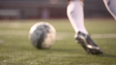 A-young-woman-does-drills-with-a-soccer-ball