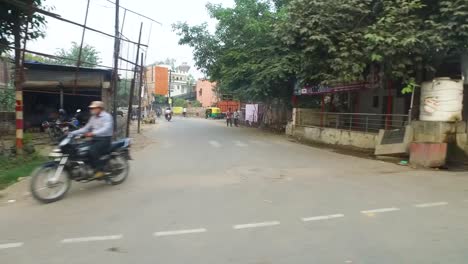 Urban-Roads-in-Sarnath-with-Traffic-and-People-Passing-by-in-a-Vehicle-in-India