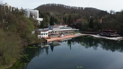 Ursu-Lake-and-Lacul-Ursu-hotel-on-shore,-Sovata-in-Romania