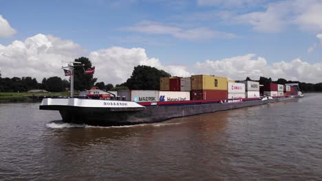 Aerial-View-Of-Alsace-Cargo-Ship-Going-Past-On-Oude-Maas-On-Sunny-Day