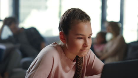 Girl-looking-laptop-screen-indoors.-Schoolgirl-using-computer-distance-learning.