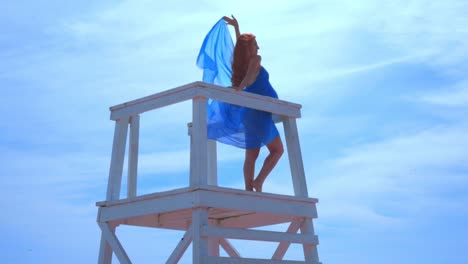 Romantic-woman-on-watchtower.-Sea-vacation.-Romantic-concept