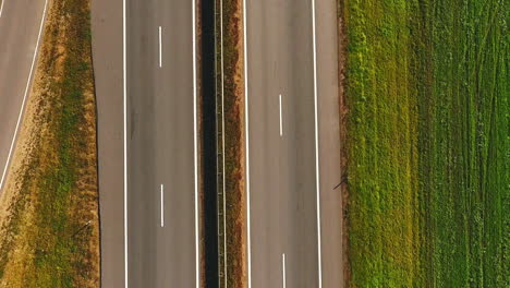 Car-traffic-highway-landscape.-Top-view-car-moving-along-highway