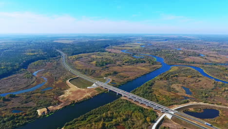 Aerial-landscape-of-highway-road-over-river.-Aerial-view-of-road-bridge