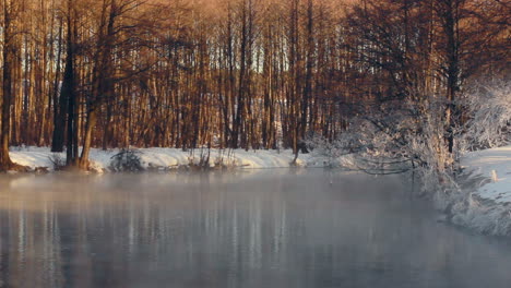 Winter-wonderland.-Winter-landscape.-Fog-over-forest-river-in-winter