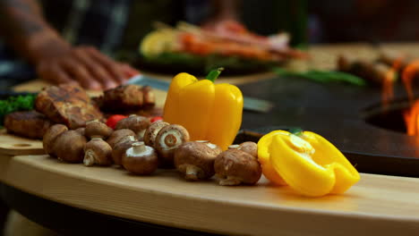 Vegetables-for-bbq-party-on-backyard.-Yellow-bell-pepper-and-mushrooms