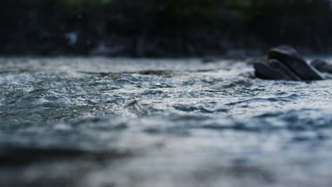 Closeup-of-clean-water-flowing-in-mountain-river.-Wild-stream-in-mountains.