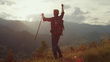 Cheerful-traveler-celebrate-freedom-outdoors.-Young-trekker-hike-mountains-hill.