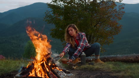 Thoughtful-hipster-travel-camping-spend-vacation-in-mountains-campfire-nature.