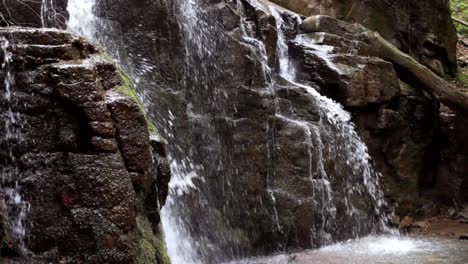Beautifull-waterfall-in-rocky-mountain.-Water-flow-downhill-in-wild-forest