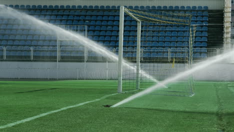 Grass-sprinkler-on-football-field.-Soccer-arena-water-irrigation.-Watering-grass