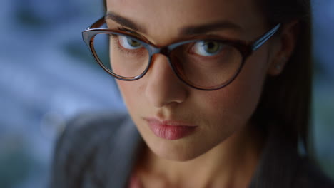 Businesswoman-looking-at-camera-in-office.-Entrepreneur-wearing-eyeglasses