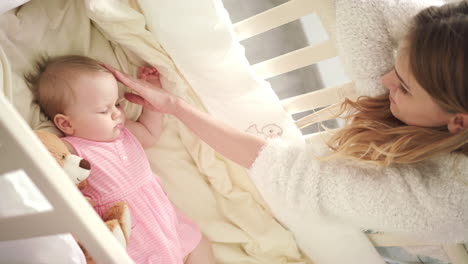 Mother-stroking-sleeping-baby.-Sweet-dream-time.-Adorable-childhood