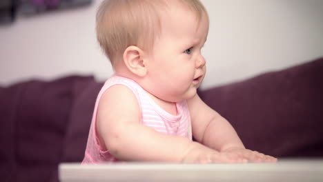Beautiful-baby-standing-on-sofa.-Sweet-child-learning-to-walk