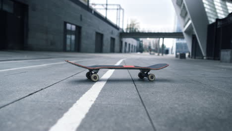 Skate-staying-on-urban-background.-Extreme-sports-concept.-Longboard-on-street.