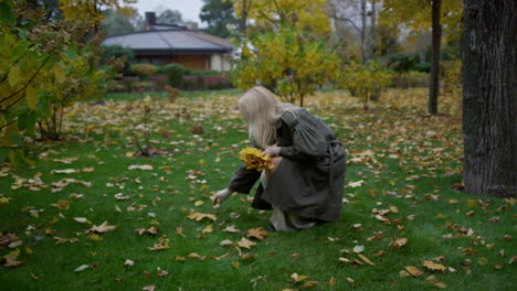 Wide-shot-of-beautiful-woman-with-long-blonde-hair-having-walk-in-autumn.