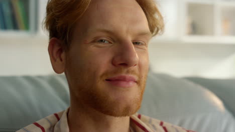 Happy-businessman-enjoy-weekend-at-home-closeup.-Smiling-ginger-guy-relaxing