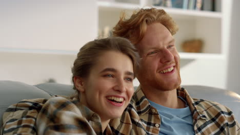 Happy-family-watch-comedy-movie-have-good-time-in-living-room-together-closeup.