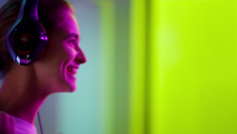 Joyful-winner-celebrating-cyber-victory-closeup.-Happy-girl-shout-in-neon-lights