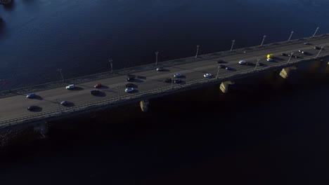 Car-driving-on-river-bridge.-Aerial-view-car-traffic-on-bridge-highway