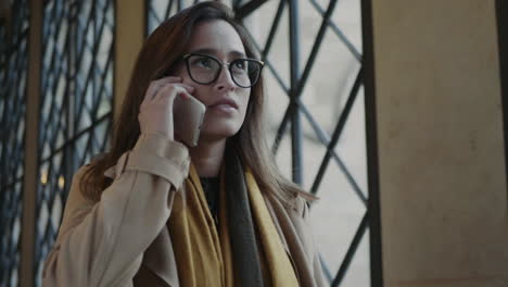 Serious-student-talking-on-phone.Businesswoman-having-conversation-on-smartphone