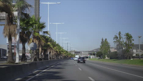 Cars-driving-on-highway-of-Barcelona.-Automobiles-moving-along-city-street