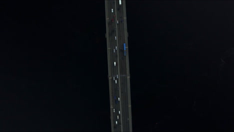 Drone-view-car-moving-on-river-bridge.-Top-view-car-traffic-on-bridge-highway