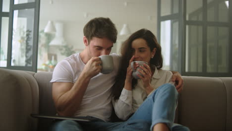 Beautiful-couple-relaxing-with-coffee-at-home.-Beautiful-couple-relaxing.
