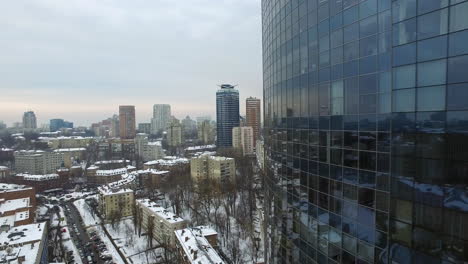 Glass-skyscraper-in-city-architecture-at-winter.-Aerial-view-business-skyscraper