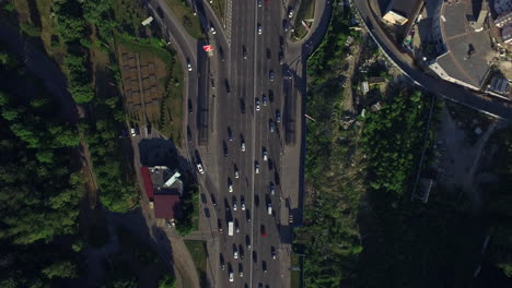Cars-moving-on-highway-road-in-city.-Aerial-view-car-traffic-on-urban-highway