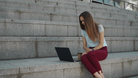 Displeased-business-woman-having-online-conversation-on-laptop-computer