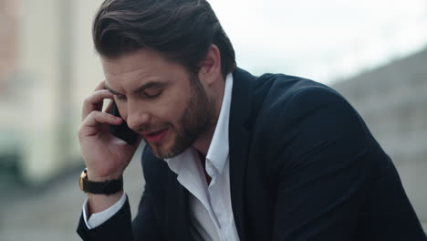 Businessman-having-conversation-on-smartphone.-Man-talking-on-mobile-phone