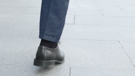 Businessman-taking-walk-on-street.-Male-executive-wearing-black-shoes-outside