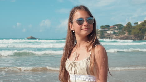 Carefree-girl-relaxing-at-seaside.-Young-woman-enjoying-vacation-at-beach.