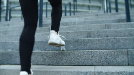 Close-up-fit-woman-legs-running-outdoor.-Closeup-female-feet-running-up-stairs