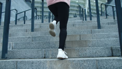 Closeup-female-legs-running-up-stairs-outdoor.-Fitness-girl-climbing-upstairs.