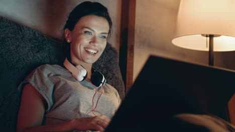 Brunette-girl-calling-online-on-webcam.-Happy-woman-having-video-call-on-laptop.