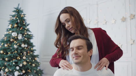 Beautiful-lovers-making-massage-in-luxury-house.-Pretty-wife-massaging-husband