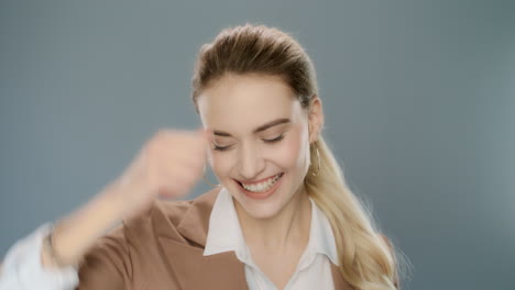 Happy-business-woman-showing-yes-gesture.-Young-businesswoman-celebrate-success