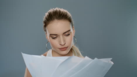 Pensive-business-woman-woman-throwing-documents-in-slow-motion