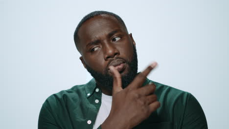 Portrait-of-pensive-african-american-guy-thinking-on-grey-background.