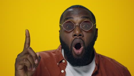 Portrait-of-thoughtful-african-american-man-thinking-on-yellow-background.