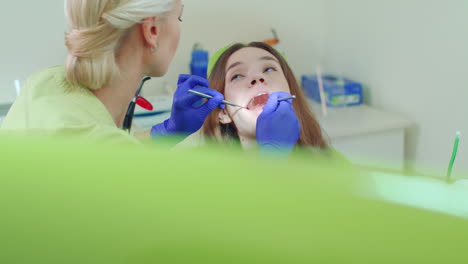 Girl-having-regular-dental-checkup.-Young-woman-visiting-her-dentist