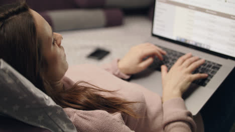 Business-woman-browsing-internet-on-computer-screen-at-home