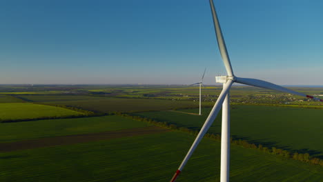 Aerial-view-of-technological-wind-towers-operating.-Windmills-producing-power.