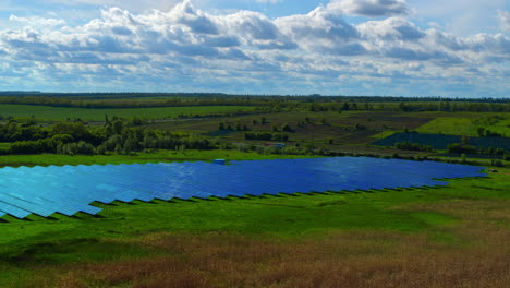 Aerial-view-solar-panels-park-in-countryside-landscape-with-cloud-sky