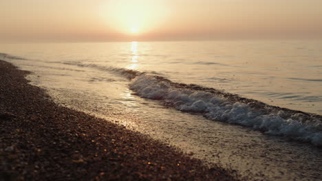 Picturesque-view-bright-sunset-on-sandy-beach.-Soft-sunlight-illuminate-ocean.