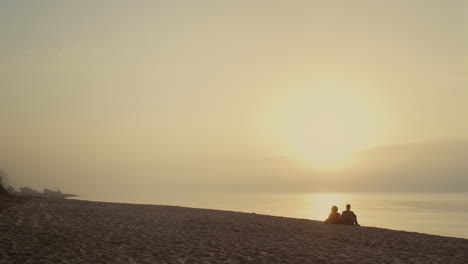 Lovely-couple-looking-sunset-beach.-Boyfriend-and-girlfriend-having-date-at-sea